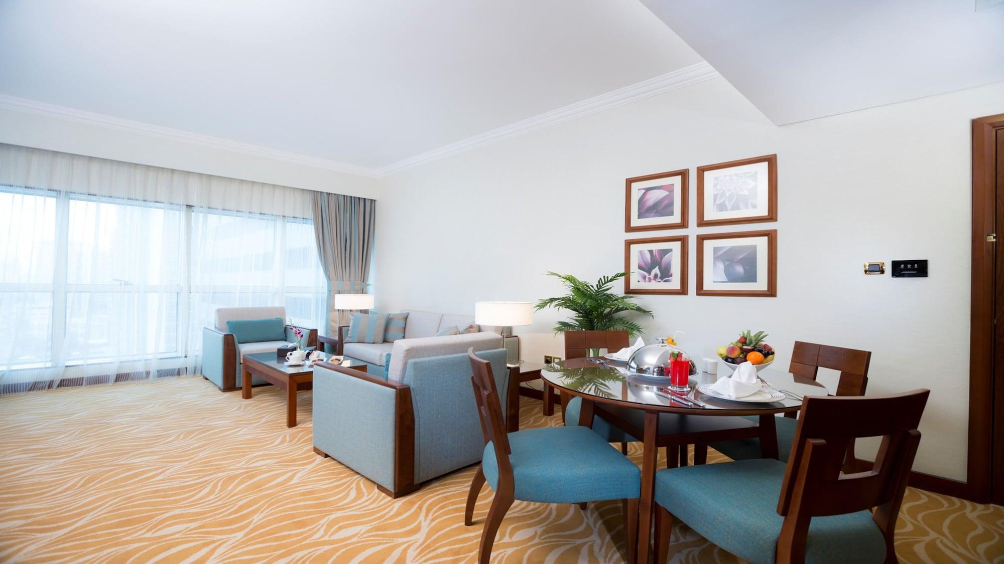 Grand Mercure Majlis Residences Abu Dhabi Eksteriør bilde A living room in a suite at the Jumeirah Beach Hotel